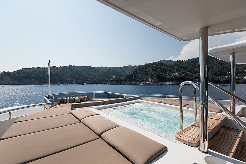 What a life: The outside living space is just as enivable, judging by the spacious hot tub which is submerged into the decking on the back of the luxurious yacht